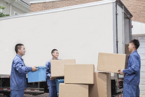 Removal team loading household items for a move