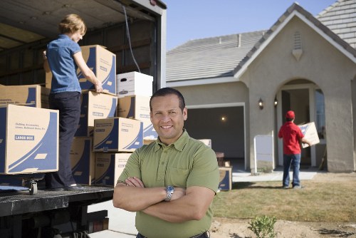 Removal van parked outside a property during a move