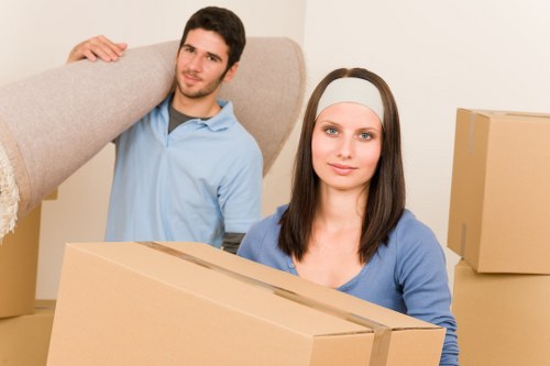 Charity donation boxes and reusable household items from a West Hampstead move